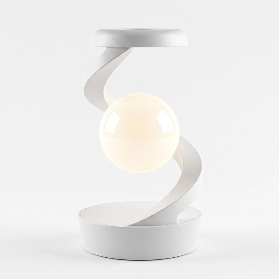 A modern white spiral table lamp with a glowing warm-white spherical bulb suspended in the center, set against a seamless light gray background.